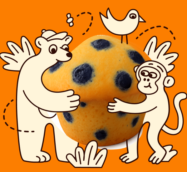 Front view of a Snack Buddies blueberry mini muffin with illustrated animal characters on an orange background